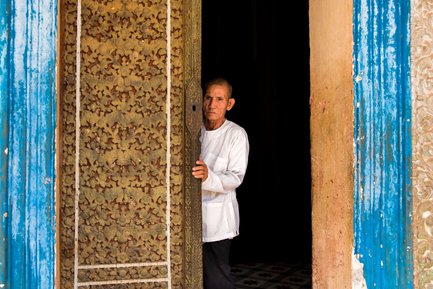 Monk in temple door